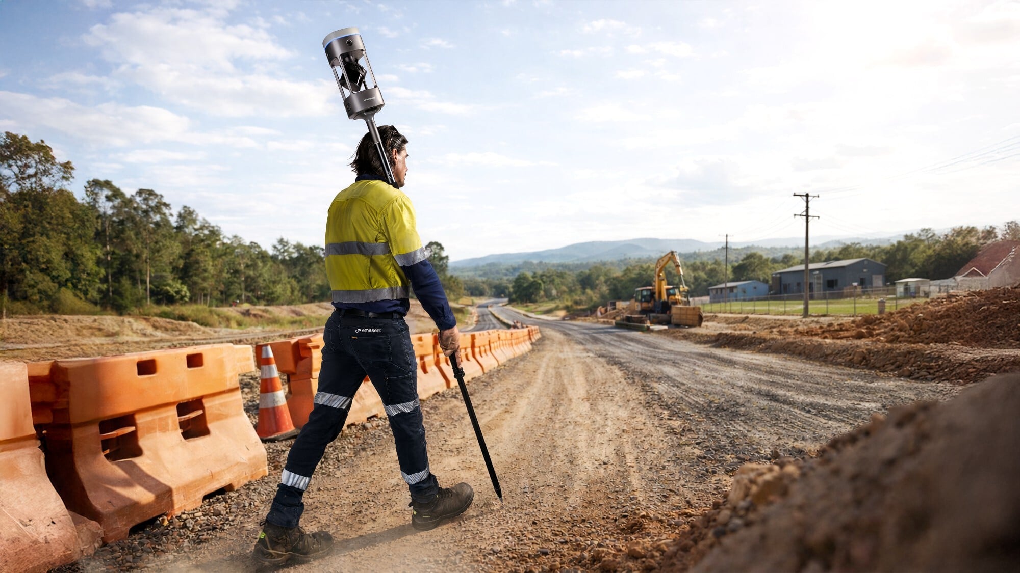 Surveyor capturing data with the Emesent GX1 on a survey pole
